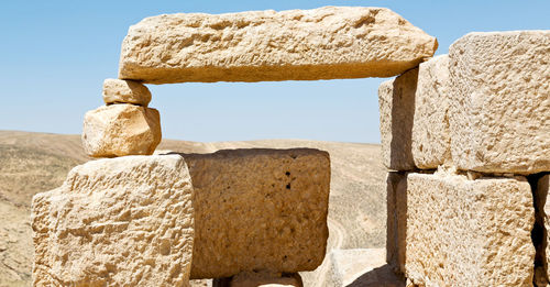 Stack of rocks against clear sky