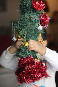 Boy holding christmas decoration