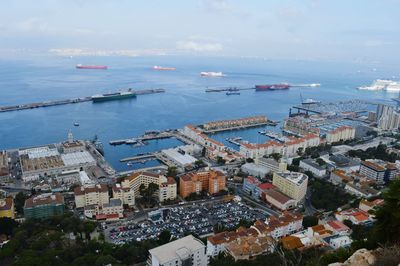 High angle view of harbor by sea against sky