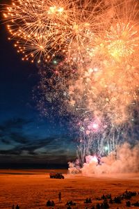 Fireworks on the beach facing the sea