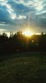 Scenic view of landscape against sky at sunset