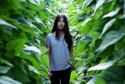 Portrait of woman standing in park