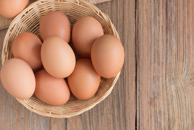 High angle view of eggs in basket on table