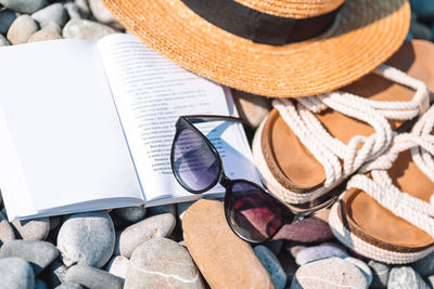 High angle view of sunglasses on rock