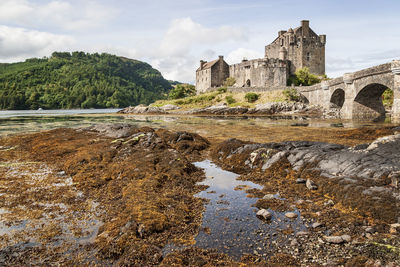 View of castle against cloudy sky