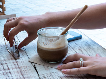 Midsection of woman holding drink