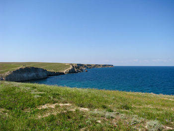 Scenic view of sea against clear sky