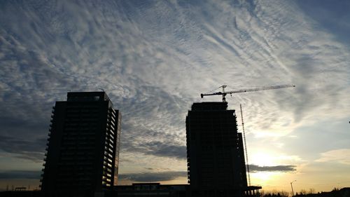 Low angle view of buildings in city against sky