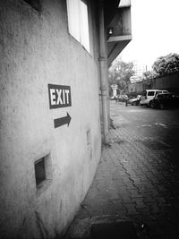 Road sign in front of building