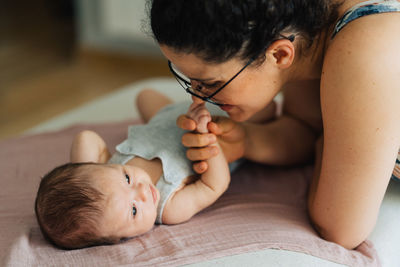 Cute baby girl with young parent