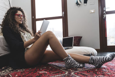 Young woman using phone