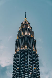 Low angle view of modern skyscraper against sky