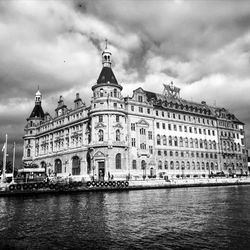 Buildings against cloudy sky