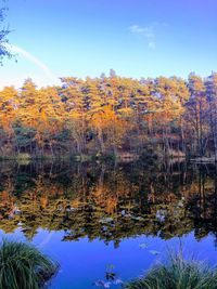 Scenic view of lake against sky during autumn