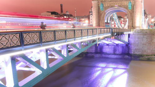 Illuminated bridge at night