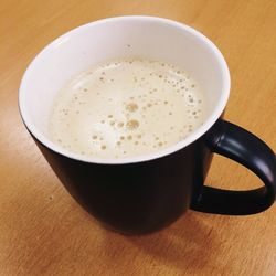 Close-up of cappuccino on table