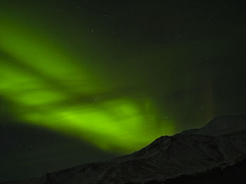 Low angle view of mountain against sky at night