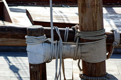 Close-up of ropes tied to wooden pole