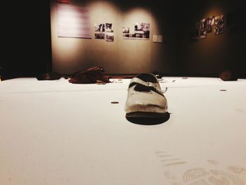 Close-up of shoes hanging on floor