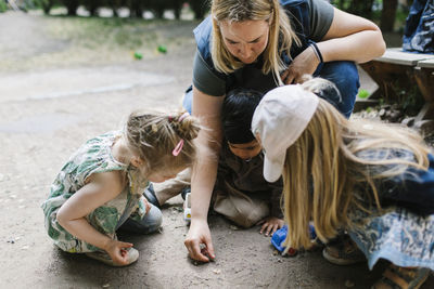 Teacher with children outside