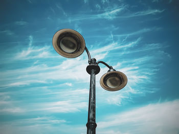 Low angle view of street light against sky