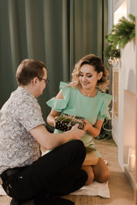 Portrait of siblings sitting at home