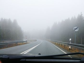 Road seen through car windshield