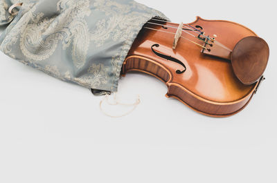 High angle view of violin on white background