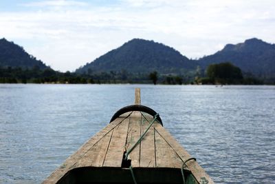 Boat sailing in lake against sky