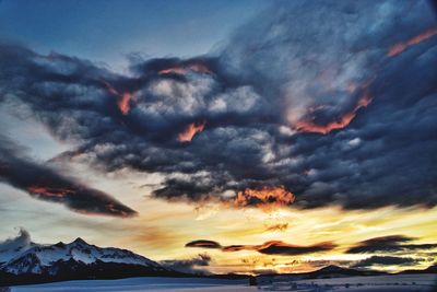 Low angle view of dramatic sky during sunset