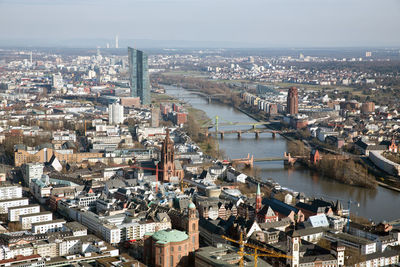 High angle view of river amidst buildings in city