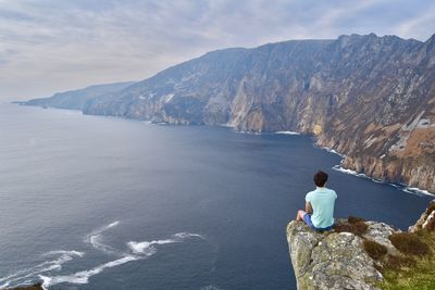 Rear view of man on cliff