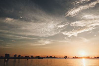 Scenic view of river at sunset