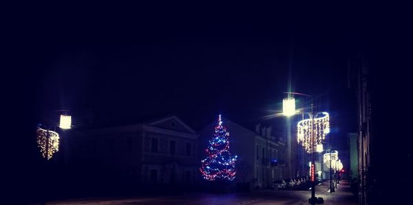 Illuminated christmas tree at night