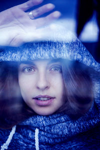 Close-up portrait of woman in winter