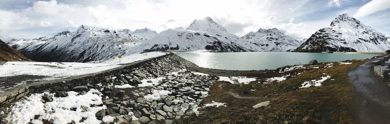 Scenic view of snowcapped mountains against sky