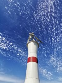 Low angle view of lighthouse against blue sky