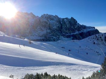 Scenic view of landscape against sky during winter