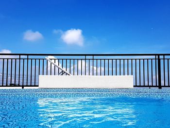 Swimming pool against blue sky