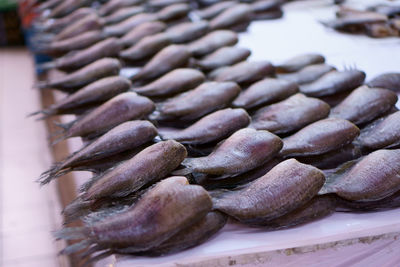 Close-up of roasted coffee beans on table