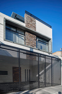 Low angle view of modern building against clear sky