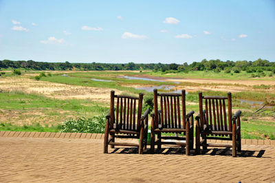 Empty seats on field against sky