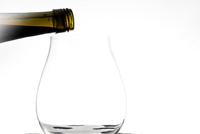 Close-up of beer bottle against white background