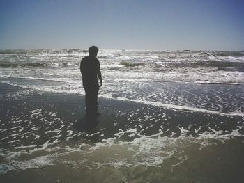 People standing on beach