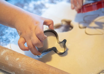 Close-up of hands working on table