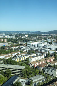 High angle view of townscape against clear blue sky