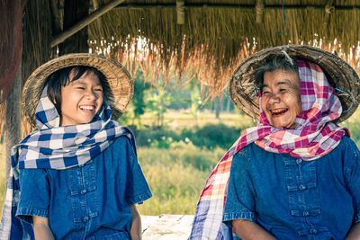 Portrait of smiling woman standing outdoors