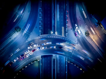High angle view of illuminated traffic on road at night