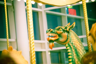 Close-up of amusement carrousel dragon