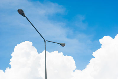 Low angle view of street light against sky